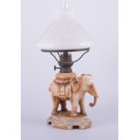 A Continental porcelain nursery lamp, probably French, stained ivory colour,