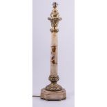 An alabaster and gilt metal mounted table lamp, slightly tapering column,