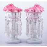 A pair of Victorian strawberry tinted milk glass lustre glasses, rounded bowls with crimped rims,