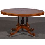 A Victorian walnut and marquetry loo table, quartered veneers with urn motifs to the tilt top,