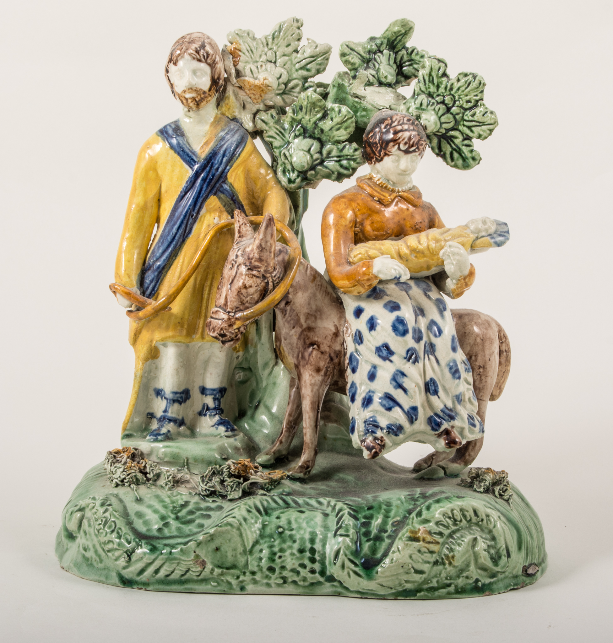 A Walton type earthenware bocage group, 'The Flight to Egypt', late 18th century,