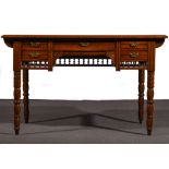 A late Victorian walnut writing table, rectangular top with a tooled leather inset, moulded edge,