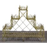 A Regency style painted wire-work three tier plant stand, step design, with an enclosed under tier,