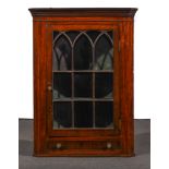 A George III mahogany hanging corner cupboard, moulded cornice,