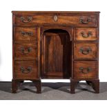 A George III mahogany knee-hole dressing table, rectangular top with a moulded edge,