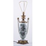 A French Empire style celadon coloured porcelain and gilt metal lamp base, amphora shape,