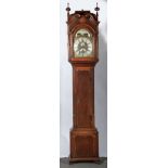 Baddley, Tong An oak and mahogany long case clock, the hood with turned finials, carved scrolls,