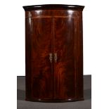 A George III mahogany cylinder front hanging corner cupboard, rosewood banding, parquetry stringing,