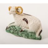 A Pearlware hollow-base model of a recumbent long-horned ram, perhaps Newcastle, circa 1800,