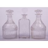 A pair of cut glass mallet-shape decanters, George III style, mushroom stoppers,