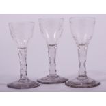 Two very similar wine glasses, probably late 18th century, each with ovoid bowls,