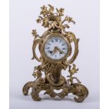 A Louis XV style ormolu mantel clock, scrolled foliate case, white enamel dial signed STILL FILS,