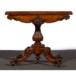 A Victorian figured walnut card table, fold-over top with an ogee moulded edge,