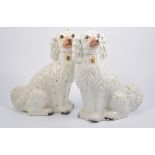 Pair of Staffordshire dogs, modelled as seated King Charles Spaniels,