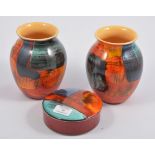 Poole Pottery two vases 17cm, 13cm; circular lidded box.