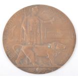 A WWI Bronze Death plaque, named - William Arhur Fink, Woolwich Arsenal stamp, 12cm.