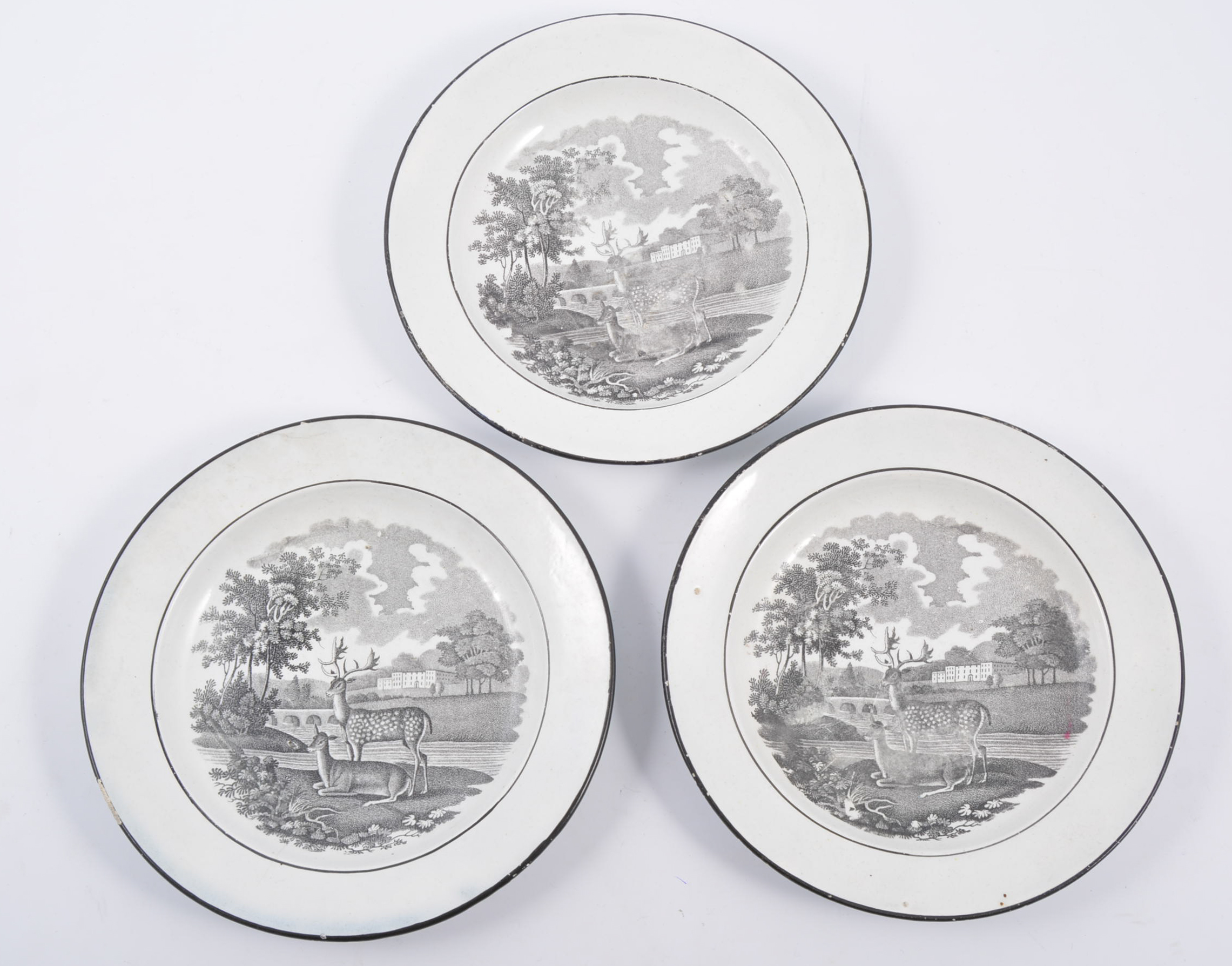 Three bat printed tea plates, deer in a landscape, 15cm.
