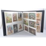 Postcards: An album of Teddy Bear related cards; together with another album - dolls, juvenilia,