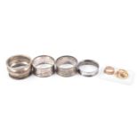9ct gold signet ring, wedding band (cut), another and two dress rings and napkin rings.