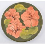 Walter Moorcroft, Hibiscus plate, diameter 26cm.