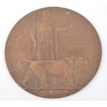 A WWI Bronze Death plaque, named - John Henry Maund, 12cm.