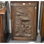 Carved oak door panel in the Black Forest style,