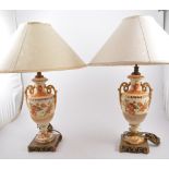 Pair of decorated pottery table lamps, metal bases with shades, 53cm.