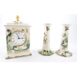 Masons 'Chartreuse' three photograph frames, pair of candlesticks, wall clock and mantel clock,