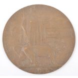 A WWI Bronze Death plaque, named - Walter Grace, Woolwich Arsenal stamp, 12cm.