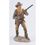 John Wayne resin rifle plaque, and other John Wayne collectables, carved figures, warming pan,