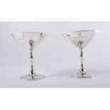 Pair of silver champagnes, Birmingham 1938, shallow conical bowls, engraved L&R MGA, 10cm.