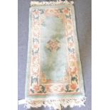 Chinese sculptured wool rug, floral design, 171cm x 91cm, together with four similar rugs.