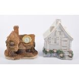Resin and pottery cottage models,