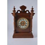 American stained wood shelf clock, circular dial with Roman numerals, a spring-driven movement,