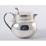 Silver jug, of squat form, Birmingham 1920, domed hinged lid, cane bound handle, 13cm.