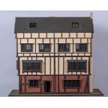 Handmade Dolls House, designed as a three-storey timber framed town house, the base 110cm x 52cm,