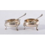 A pair of silver Hester Bateman cauldron salts, fine bead edge supported on three hooved feet,