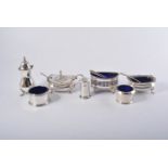 Three-piece silver condiment set, Birmingham 1922, gadrooned outlines, raised on paw feet,