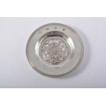 Silver Armada dish, London 1962, centred with a Tudor rose, diameter 12cm.