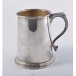 A contemporary silver tankard, plain polished straight sided tapered form 13cm high on rim foot,