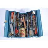 Blue mechanic's toolbox containing tools and miscellaneous items.