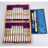 Set of twelve Edwardian dessert knives and forks, plated blades,