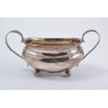 Georgian III silver sugar basin, twin leaf-capped handles, gadrooned edge, four ball feet,