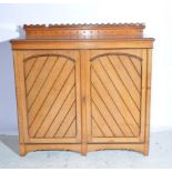 Gothic Revival oak cabinet, castellated low back rectangular top, moulded edge, plain frieze,