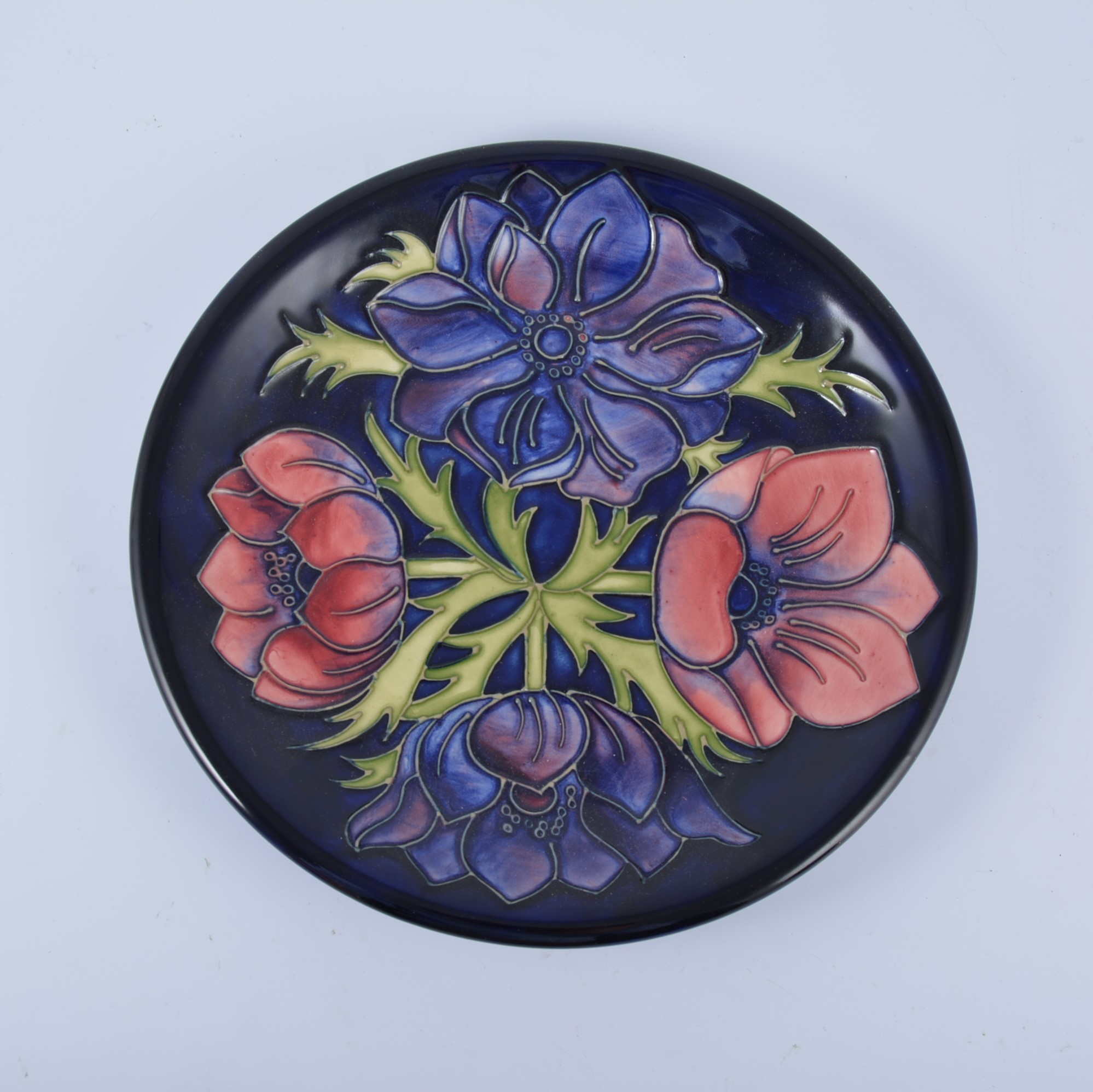 Walter Moorcroft, 'Anemone' plate, 1994, navy ground, 25.5cm diam.