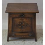 Oak cabinet with flat front, carved panel,