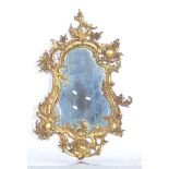 French Rococo style mirror, cast and gilt metal frame, shield-shaped plate, 83cm.