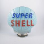 A "Super Shell" petrol pump globe, pale blue glass with red and dark blue enamelled lettering,