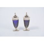 Pair of silver salts with blue glass liners, wire basket design, 11cm high, Hallmarked London 1920.