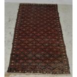 Caucasian long rug, patterned botah motifs on a dark blue ground, multi bordered, worn and repaired,